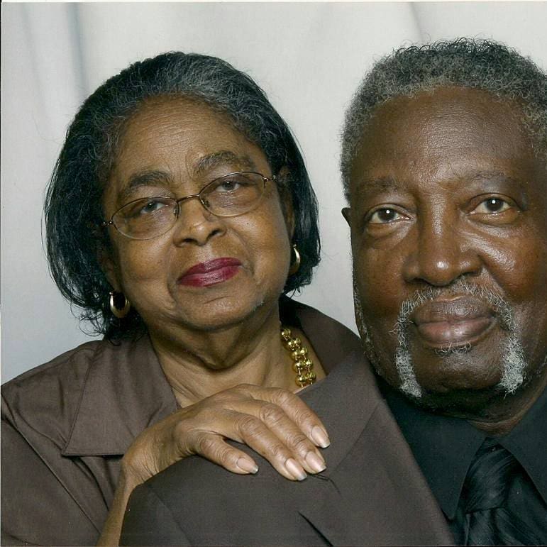 A man and woman posing for the camera.
